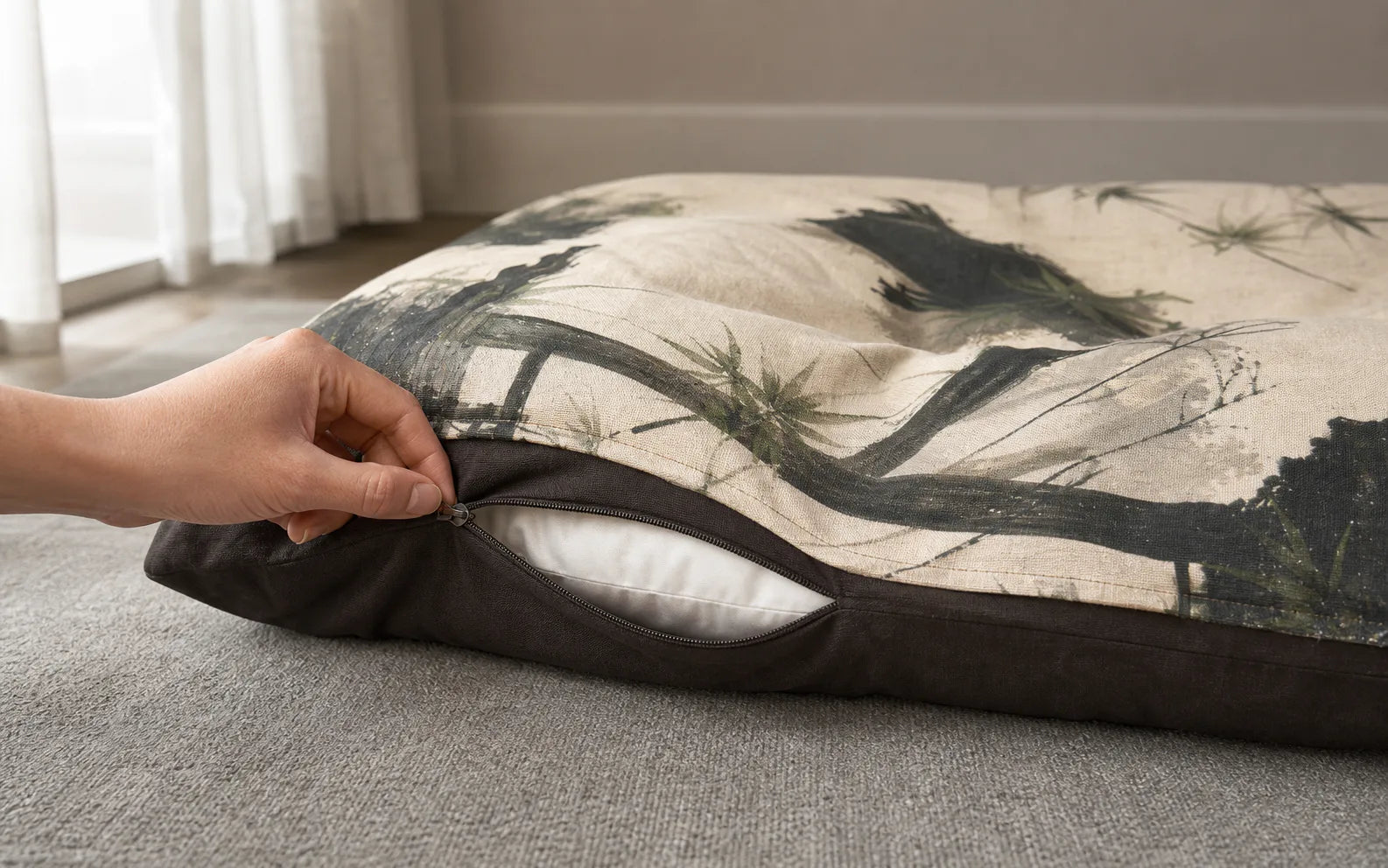 Hand opening the pet bed cover zipper